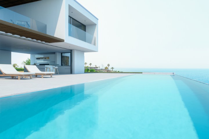 Contemporary custom infinity pool with clean lines and stunning sea views